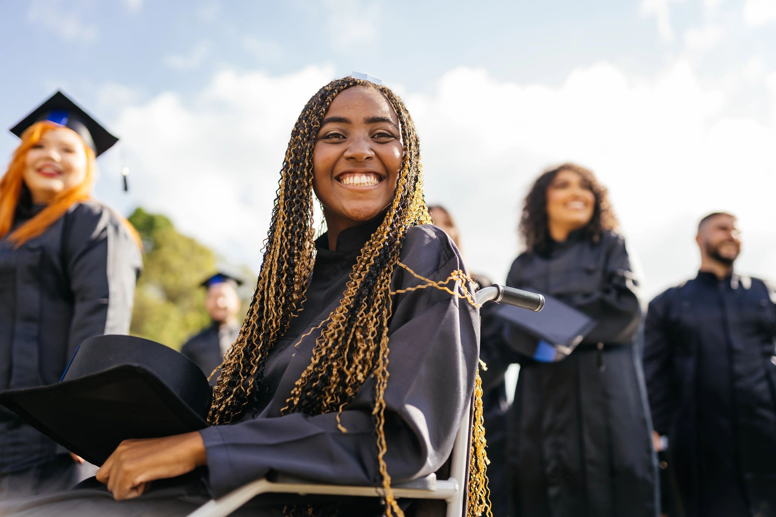 Graduate in cap and gown at commencement
