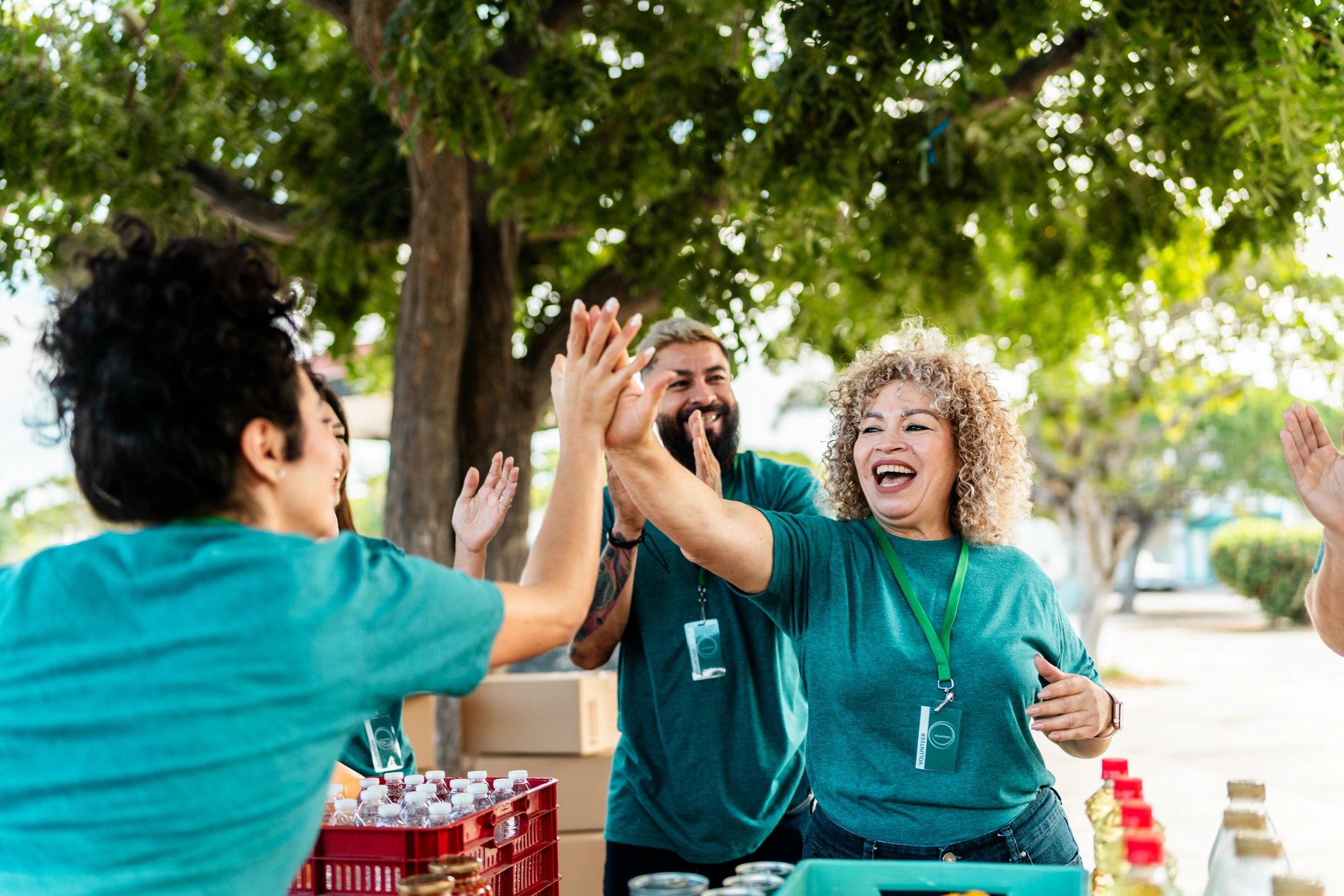 Volunteers organizing donation boxes outdoors